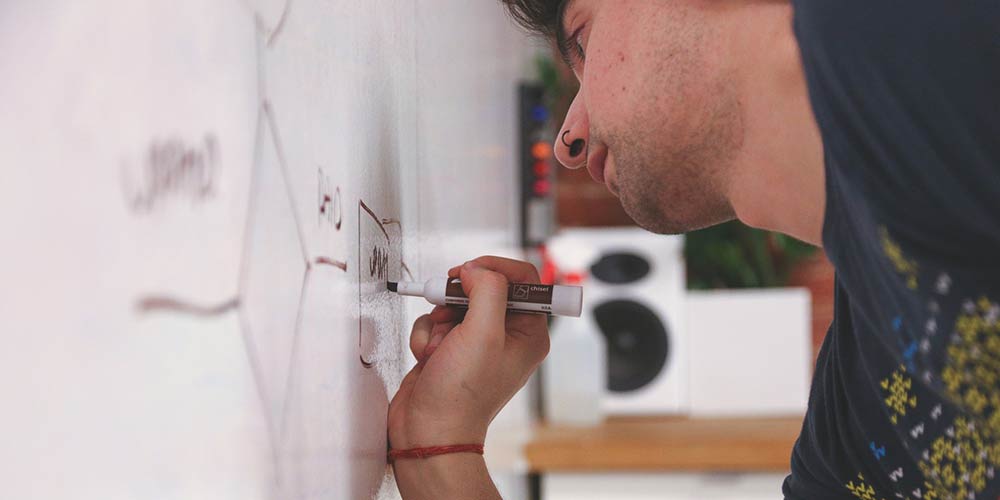 Man writing on a whiteboard